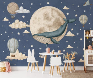 Pastel dreamy wallpaper with whale motif in kids bedroom by Igibee