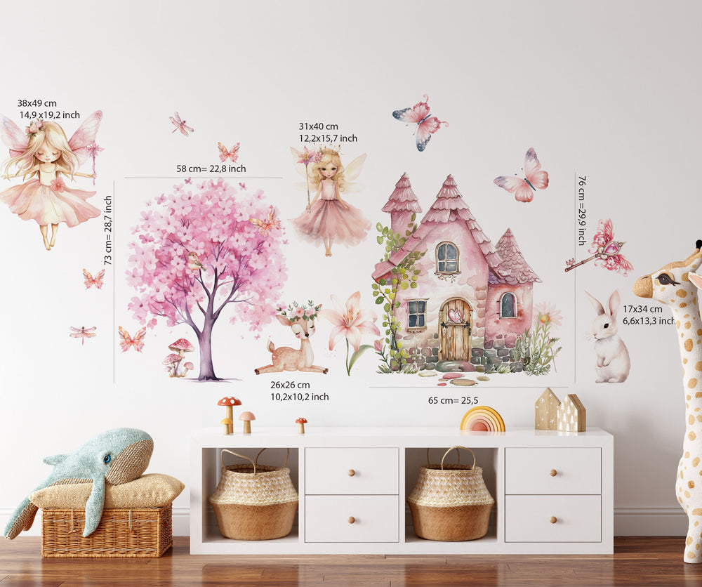 Watercolor fairy wall decals with cute magical fairies in pink dresses and butterflies decorating a cozy girls bedroom wall.
