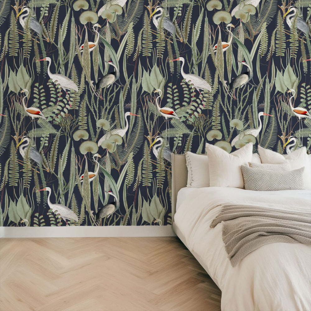 Dark crane wallpaper with botanical motifs by Igibee