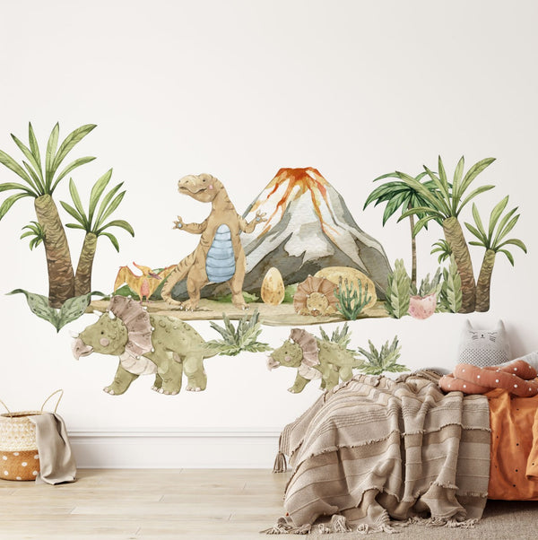 Akvarelové samolepky na zeď „Dinosauří země" nad dětskou postílí, s T-Rexem, rodinou triceratopsů, palmami a sopkou