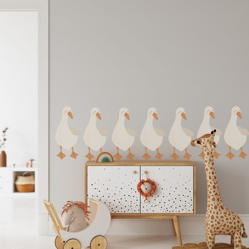 Goose wall decals arranged in a flock on a nursery wall