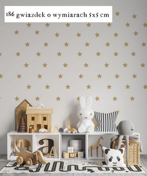 Self-adhesive gold stars as wall decoration in a child's room