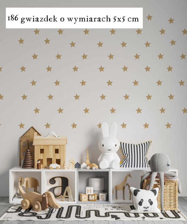 Self-adhesive gold stars as wall decoration in a child's room