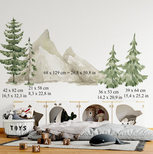 Forest wall decals: Whimsical forest wall decals showing pine trees and mountains in a bright, playful children’s playroom