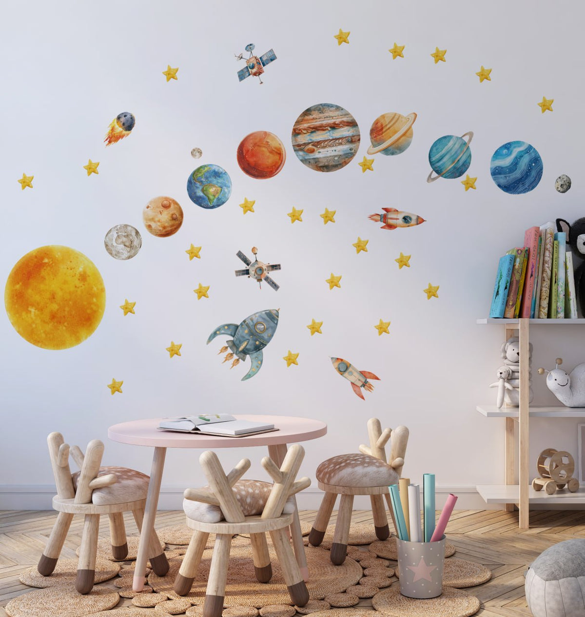 Watercolor solar system wall decals in a kids room - Sun, planets, rockets and stars above a play table by Igibee