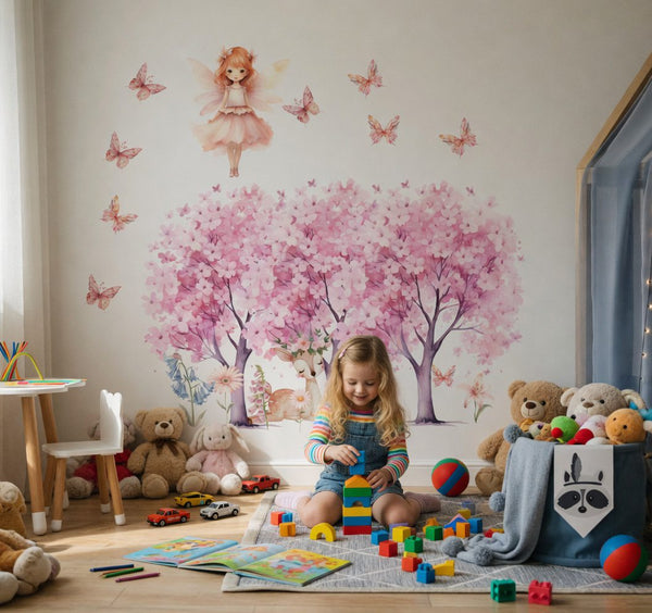 Fairy wall decals with pink blooming trees and a deer in a child's room